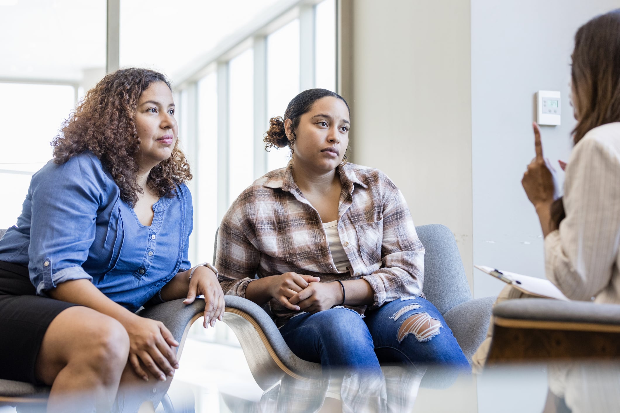counselor in session with a mother and daughter