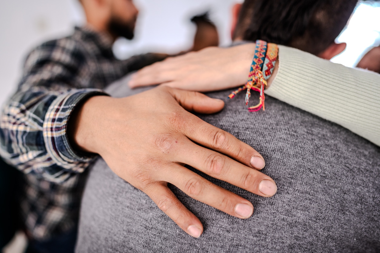 people supporting and participating in group therapy