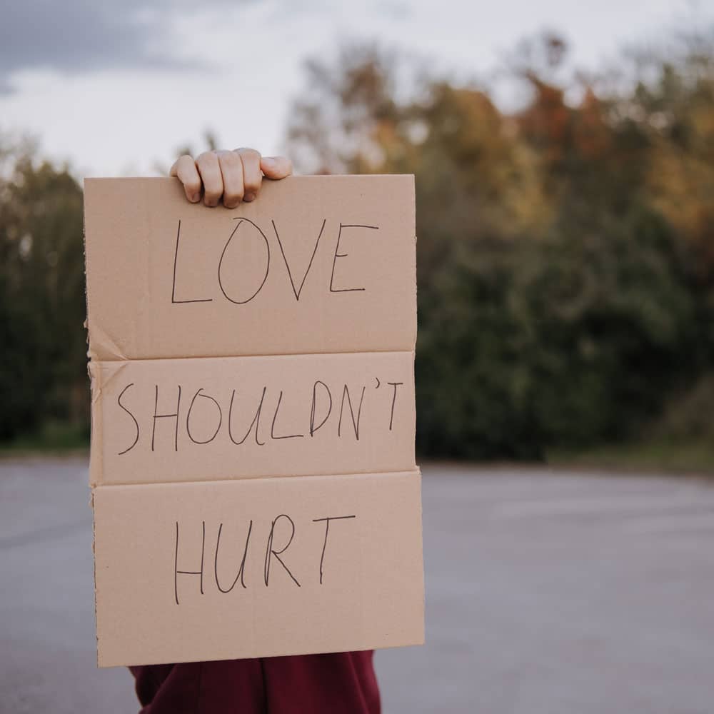 love shouldn't hurt sign