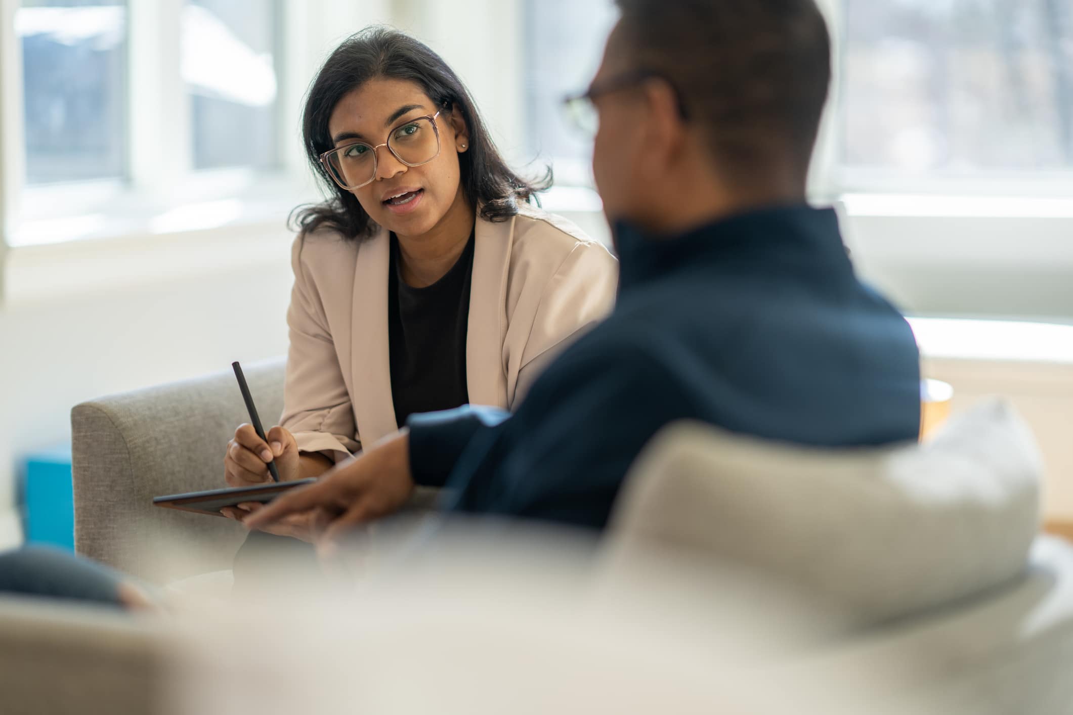 therapist/counselor speaking to patient