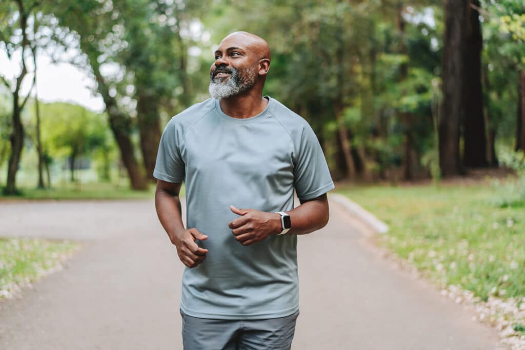 Portrait of a mature man running in the public park